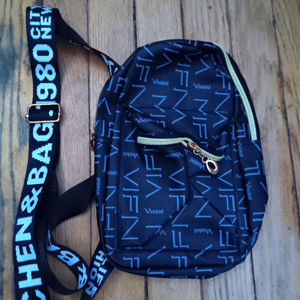Blue bag with white logo on strap